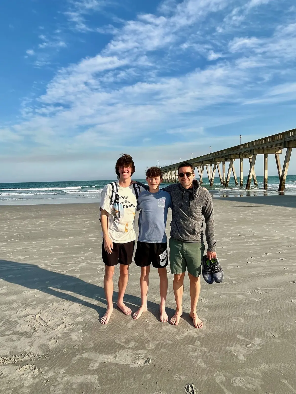 Adam and our two boys on the beach